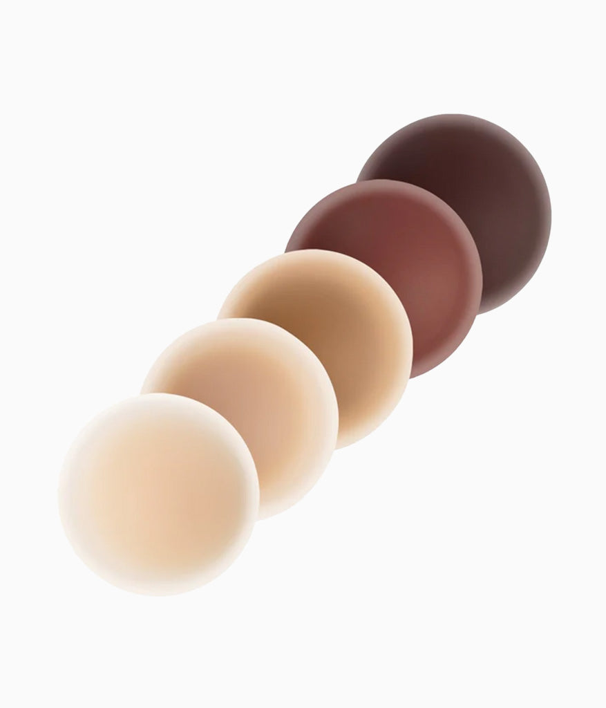 Five graduated spheres in shades from light beige to dark brown arranged diagonally