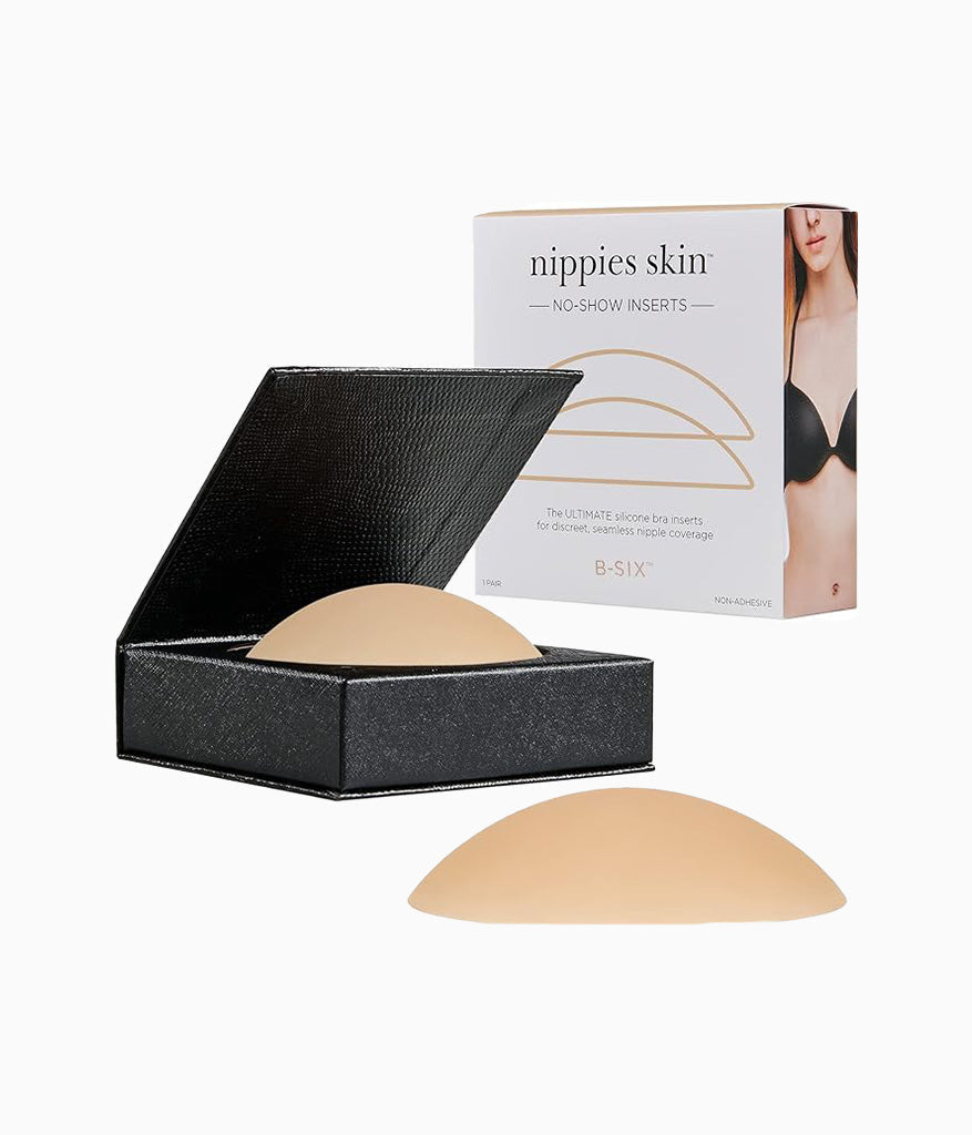 Nippies Skin no-show inserts with packaging, black box, and beige silicone covers displayed