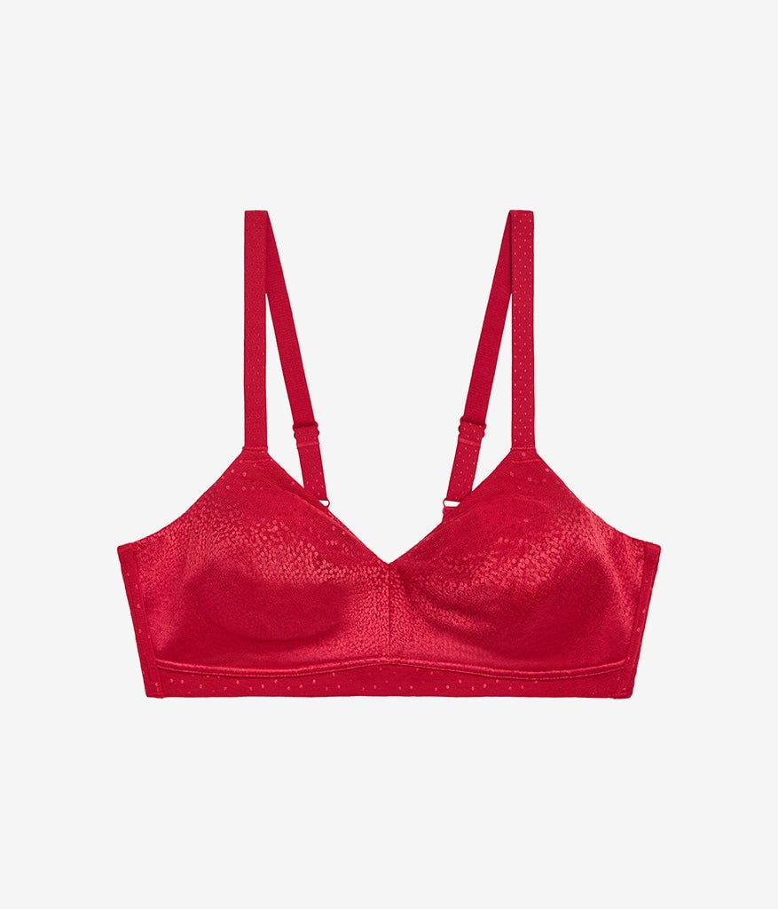 Red unlined bra with soft jacquard fabric, shown front view with mid coverage cups and adjustable shoulder straps